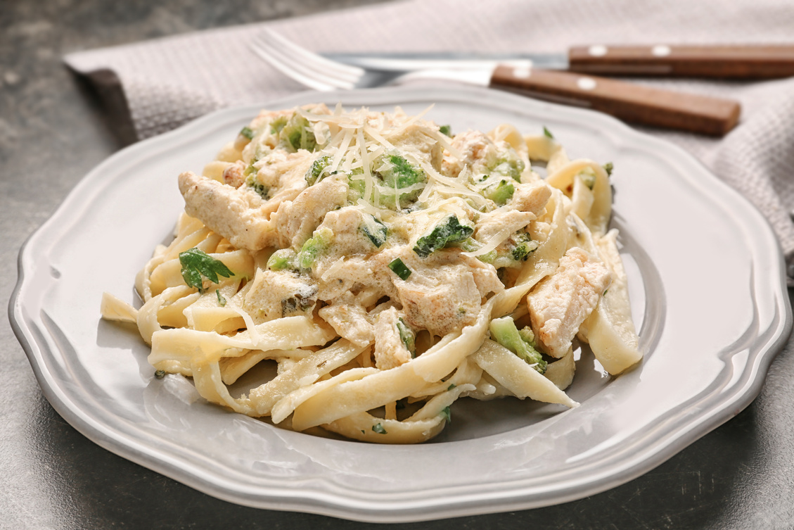 Plate with Chicken Alfredo on Table